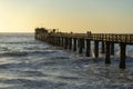 Old long wooden jetty at sunset Royalty Free Stock Photo