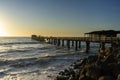 Old long wooden jetty at sunset Royalty Free Stock Photo