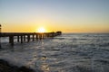 Old long wooden jetty at sunset Royalty Free Stock Photo