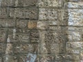 Old looking stone rocks wall or floor with bricks tiles stacked on each other with cement and other rough material, professional