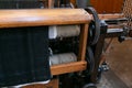 Old loom, spinning machine, rows of white and colored cotton threads Royalty Free Stock Photo
