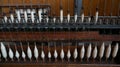 Old loom, spinning machine, rows of white and colored cotton threads Royalty Free Stock Photo