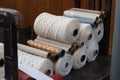 Old loom, spinning machine, rows of white and colored cotton threads Royalty Free Stock Photo