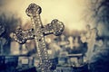 Old lop-sided sepulchral crosses on the graves at the cemetery.