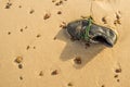 Old, lost shoe on a beach Royalty Free Stock Photo