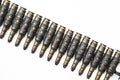 Old machine gun's bullets on white background Royalty Free Stock Photo