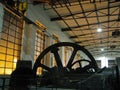 An old machine hall with large flywheels. Royalty Free Stock Photo