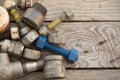 Old machine parts in machinery shop on wooden background, industry background with damaged parts of the machine and empty area Royalty Free Stock Photo