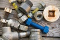 Old machine parts in machinery shop on wooden background, industry background with damaged parts of the machine and empty area Royalty Free Stock Photo