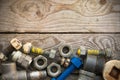 Old machine parts in machinery shop on wooden background, industry background with damaged parts of the machine and empty area Royalty Free Stock Photo