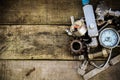 Old machine parts in machinery shop on wooden background.old machine with vintage picture style Royalty Free Stock Photo