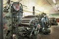 An old machine at an abandoned textile factory in the morning sun Royalty Free Stock Photo