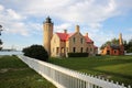 Old Mackinac Point Lighthouse at sunset time, with Mackinac Bridge in the background, Mackinaw City, Michigan, USA Royalty Free Stock Photo