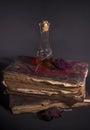 Old magic books and a vial with mysterious liquid