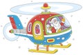 Santa Claus piloting his colorful helicopter