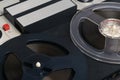 Old magnetic tape recorder on a gray table background, close-up Royalty Free Stock Photo