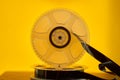 Old magnetic tape reels on yellow background. Royalty Free Stock Photo