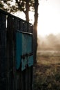 Old mailbox early in the morning on the fence Royalty Free Stock Photo