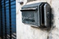 Old mailbox on the front concrete wall of a house. Royalty Free Stock Photo