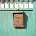 Old Mailbox on a green gate Royalty Free Stock Photo