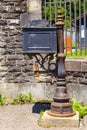 Old mailbox near the gate of a house Royalty Free Stock Photo