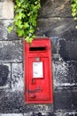 old mailbox on stone wall Royalty Free Stock Photo