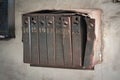 Old mailboxes in the entrance hall white wall of an old weathered residential house Royalty Free Stock Photo