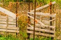 Old make shift retaining fence in rural farm field. Royalty Free Stock Photo