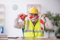 Old male architect holding caution tape Royalty Free Stock Photo