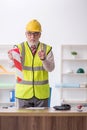 Old male architect holding caution tape Royalty Free Stock Photo