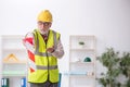 Old male architect holding caution tape Royalty Free Stock Photo