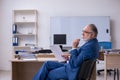 Old male boss employee working in the office Royalty Free Stock Photo