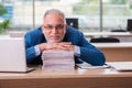 Old male boss employee working in the office Royalty Free Stock Photo