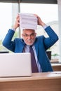 Old male boss employee working in the office Royalty Free Stock Photo