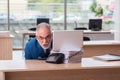 Old male boss employee working in the office Royalty Free Stock Photo