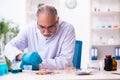 Old male chemist working in the lab Royalty Free Stock Photo