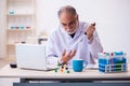 Old male chemist working in the lab Royalty Free Stock Photo