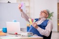 Old male designer working in the office Royalty Free Stock Photo