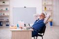 Old male designer working in the office Royalty Free Stock Photo