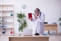 Old male doctor otologist working in the clinic