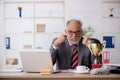 Old male employee being awarded with golden cup Royalty Free Stock Photo