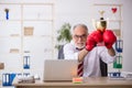 Old male employee boxer being awarded with golden cup