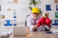 Old male employee boxer being awarded with golden cup