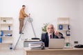 Old male employee and too much work in the office Royalty Free Stock Photo