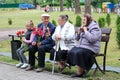 An old male grandfather is a veteran of World War II sitting on a bench with victory Moscow, Russia, 05.09.2018