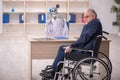 Old patient in wheel-chair visiting devil doctor