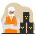 A old male specialist next to black barrels with an image warning about the toxicity of waste. Radiation.
