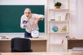 Old male teacher in time management concept Royalty Free Stock Photo