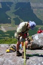 Old man adjust gear for rope climbing