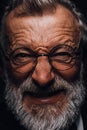 Old man with angry evil horror expression on face, close up on black background Royalty Free Stock Photo